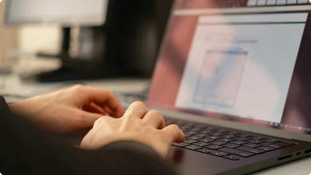 Person typing on a laptop
